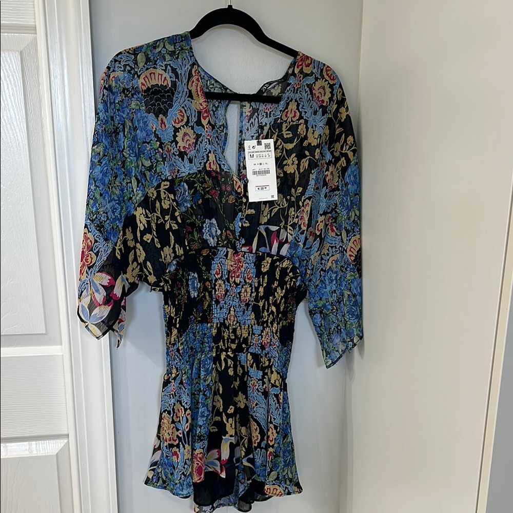 Zara Romper Blue Floral Asymmetrical Blouse with Flutter Sleeves